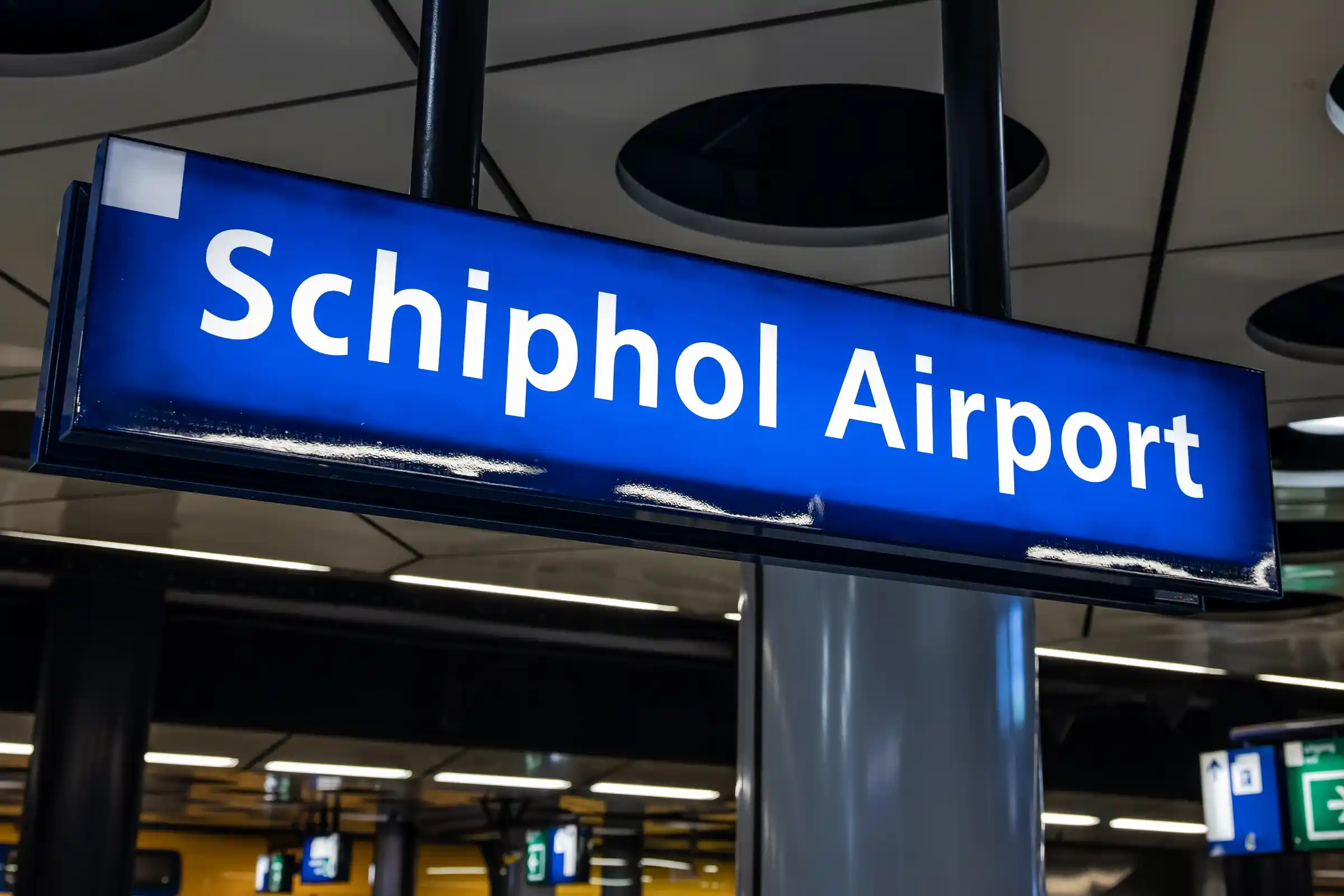 Private chauffeur airport transfer Amsterdam Schiphol — arrivals hall