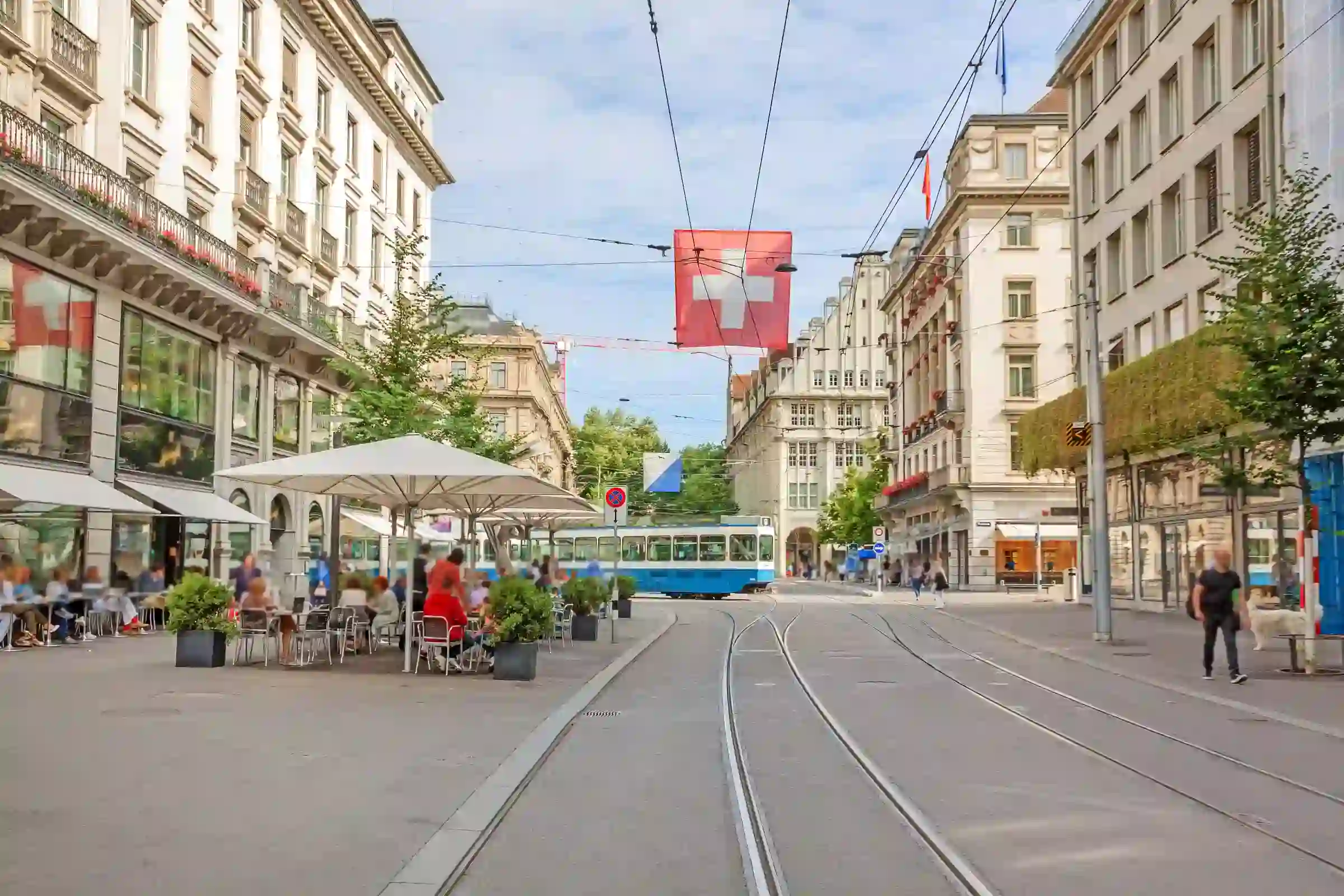 Bahnhofstrasse Zurich tram and Swiss flag luxury shopping street